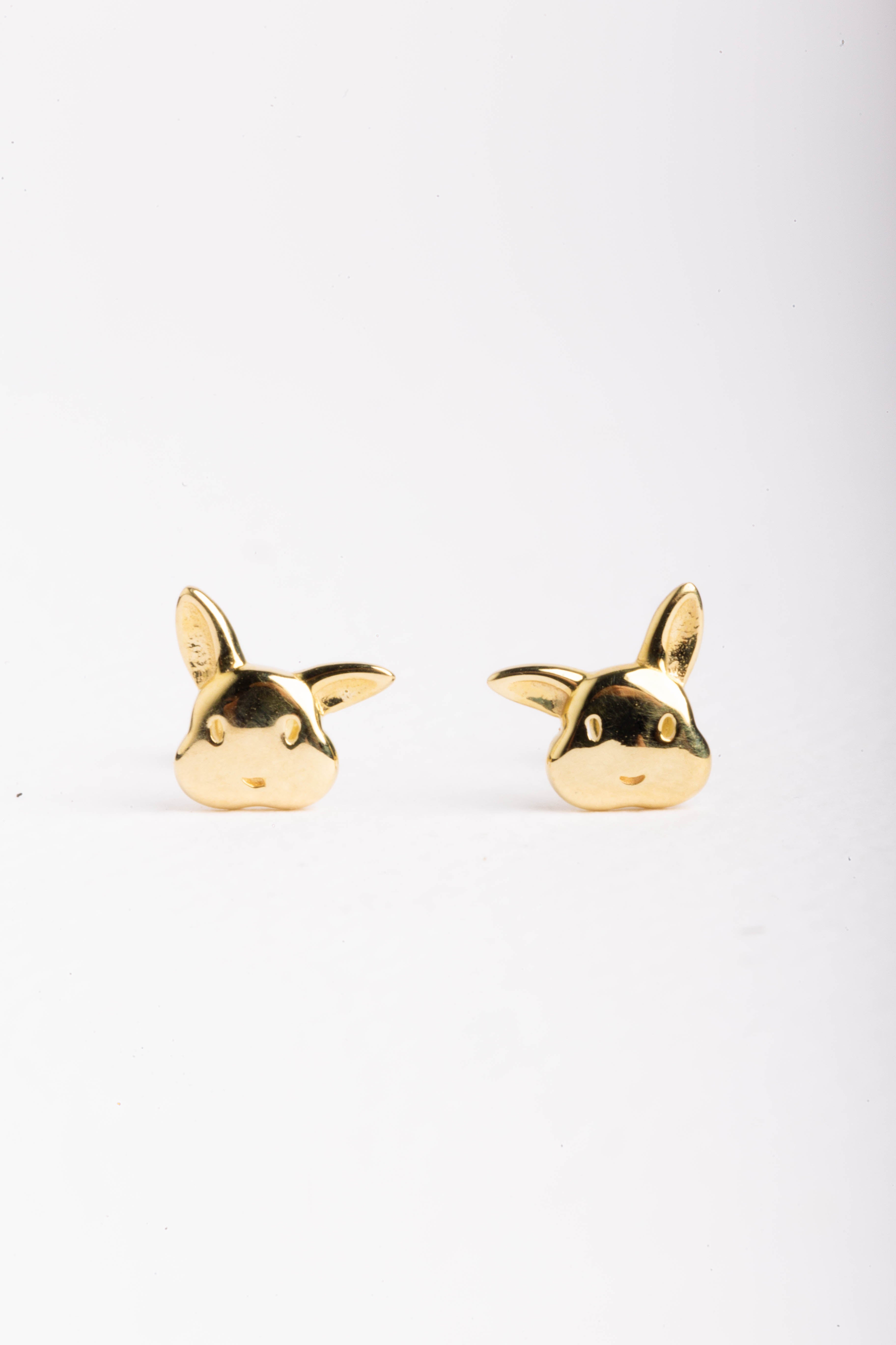 Broquel de oro sólido 10K Conejito oreja chueca 0.5 cm x 0.6 cm