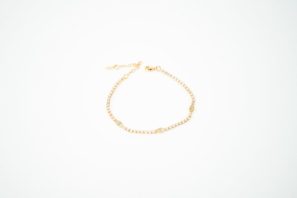 Pulsera  baño de oro de 18k dorada ojos con zirconia turquesa