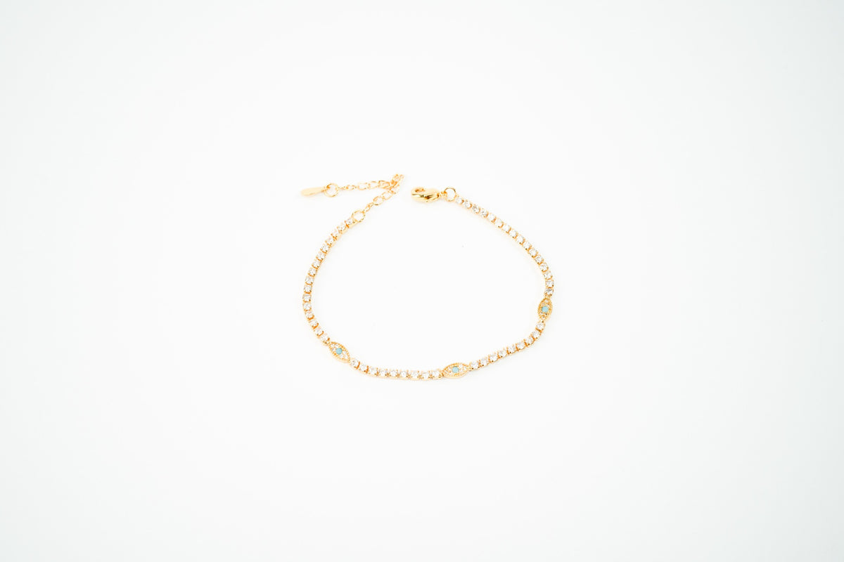 Pulsera  baño de oro de 18k dorada ojos con zirconia turquesa