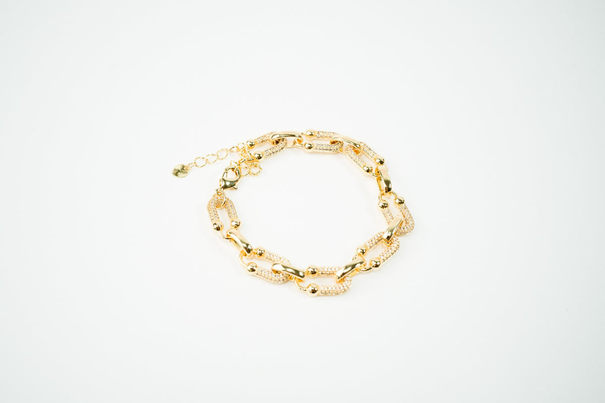 Pulsera baño de oro 18k dorada tipo u con zirconias y bolitas ajustable