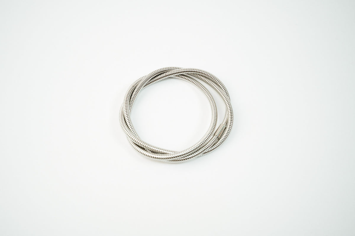 Pulsera acero inoxidable WATERPROOF de resorte enredada triple plateada