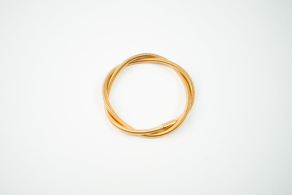 Pulsera acero inoxidable WATERPROOF de resorte enredada triple dorada