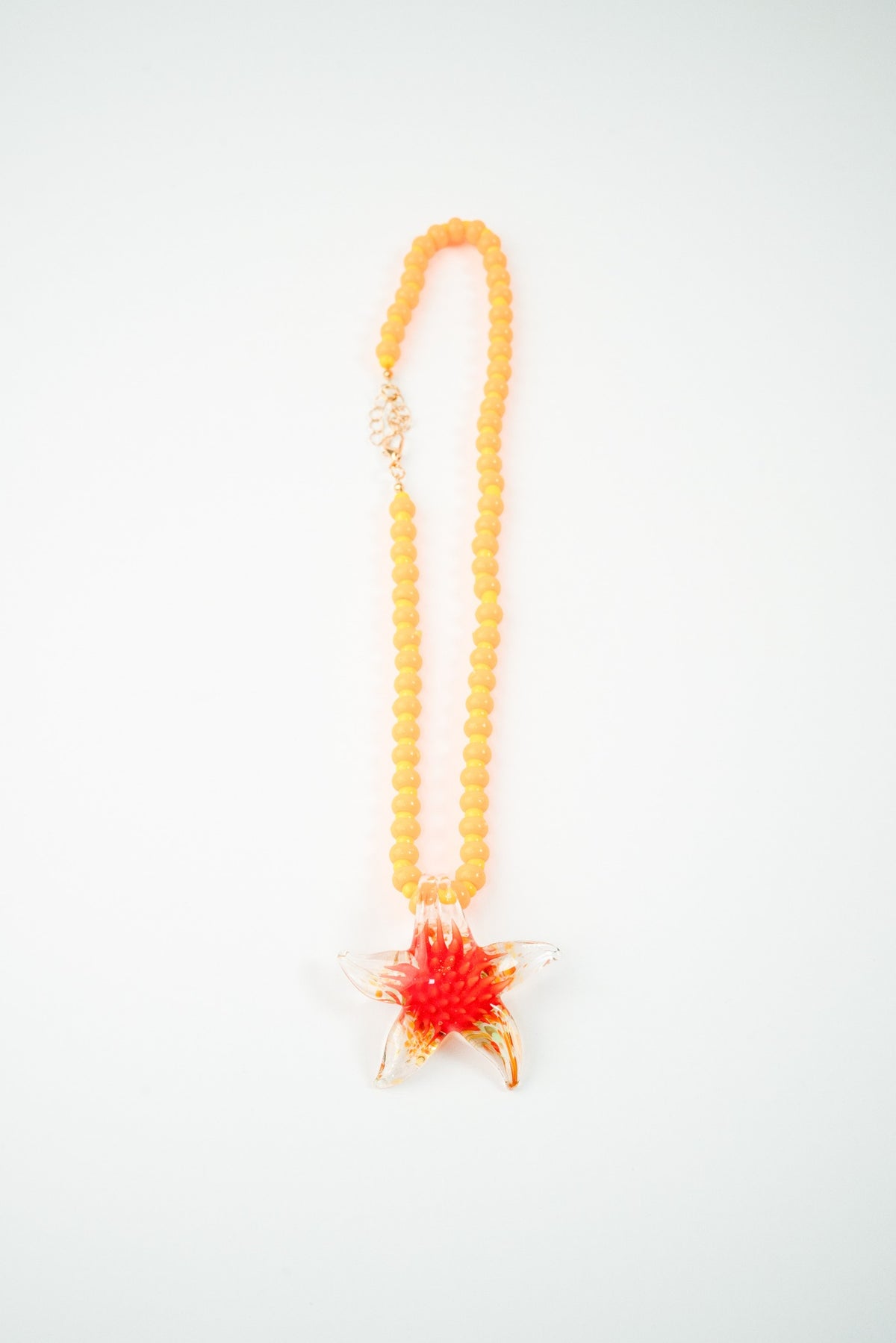 Collar vidrio solpado estrella naranja